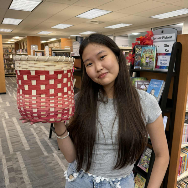 Teen holding basket
