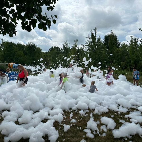 children playing in mounds of foam